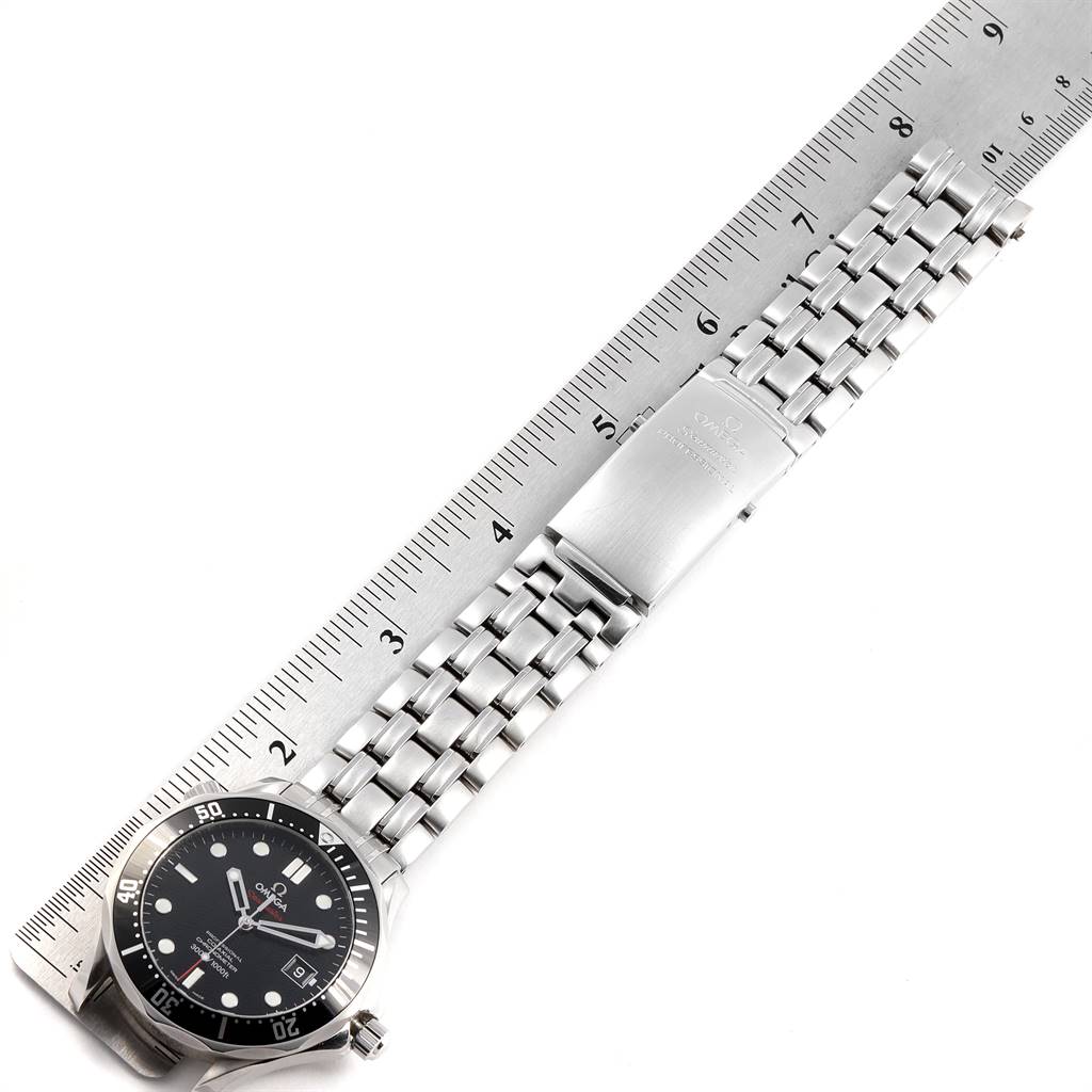 The Omega Seamaster 212.30.41.20.01.002 Men
s Stainless Steel Black Dial 212.30.41.20.01.002 Men
s Stainless Steel Black Dial watch is laid flat, showing the face, stainless steel bracelet, and clasp with a ruler for measurement.