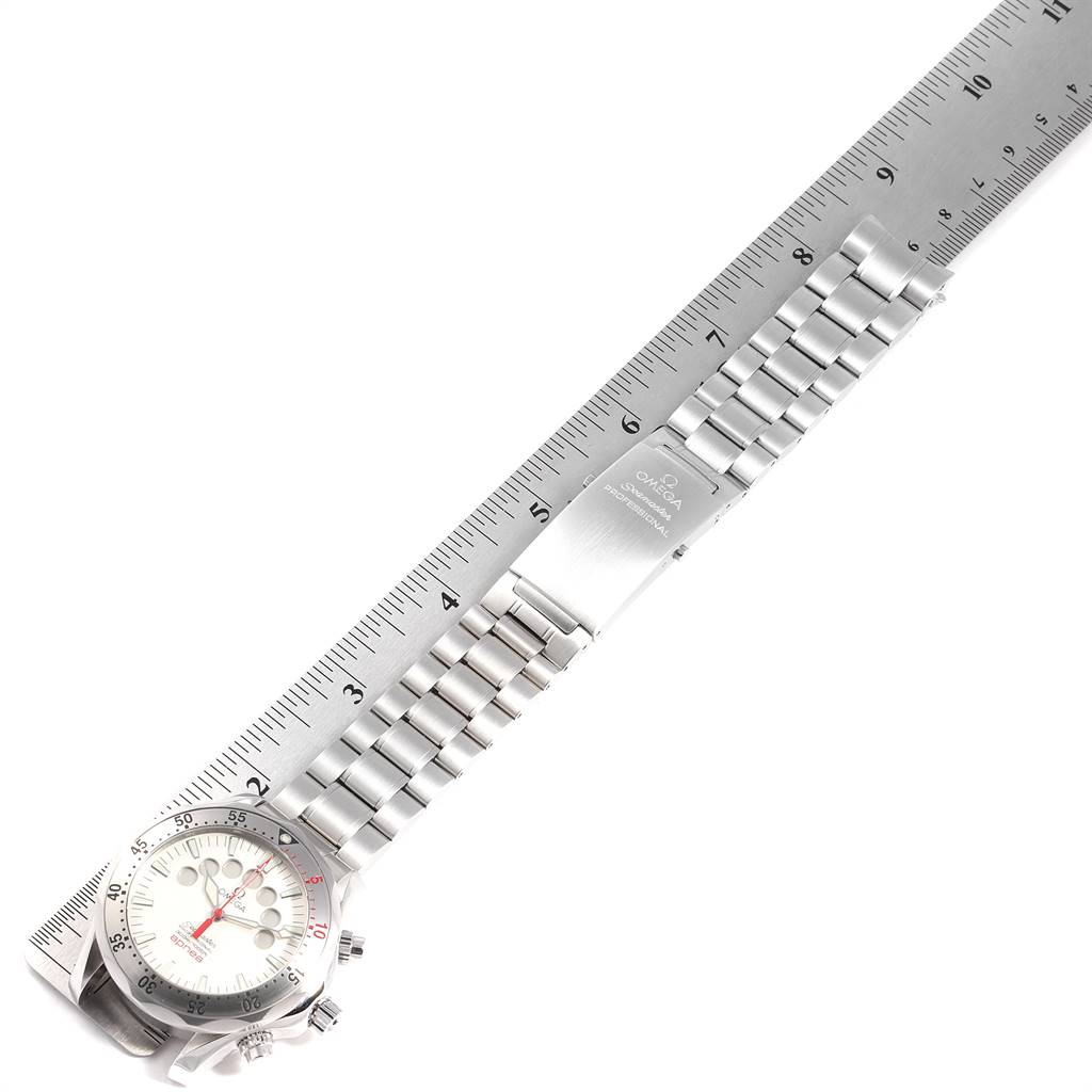 The image shows an Omega Seamaster 2595.30.00 Men
s Stainless Steel Silver Dial 2595.30.00 Men
s Stainless Steel Silver Dial watch laid next to a ruler, highlighting its watch face, bracelet, and clasp.