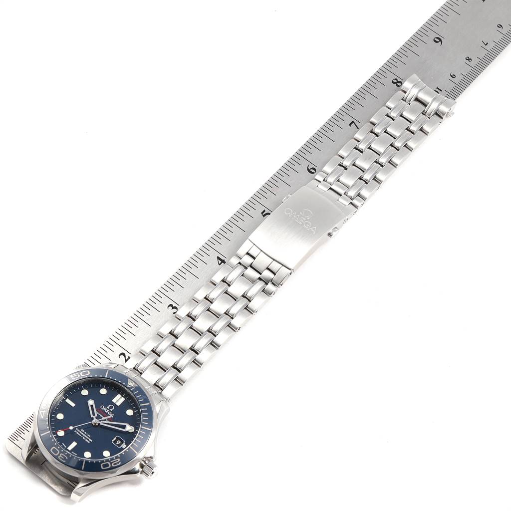 This image shows an Omega Seamaster 212.30.41.20.03.001 Men
s Stainless Steel Blue Dial 212.30.41.20.03.001 Men
s Stainless Steel Blue Dial watch with a stainless steel bracelet, laid flat against a ruler.