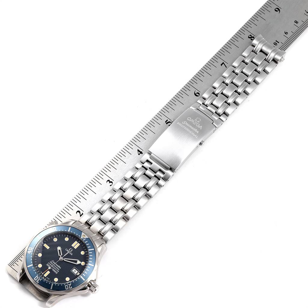 This image shows an Omega Seamaster 2531.80.00 Men
s Stainless Steel Blue Dial 2531.80.00 Men
s Stainless Steel Blue Dial watch laid flat with a stainless steel bracelet and clasp, alongside a ruler for scale.