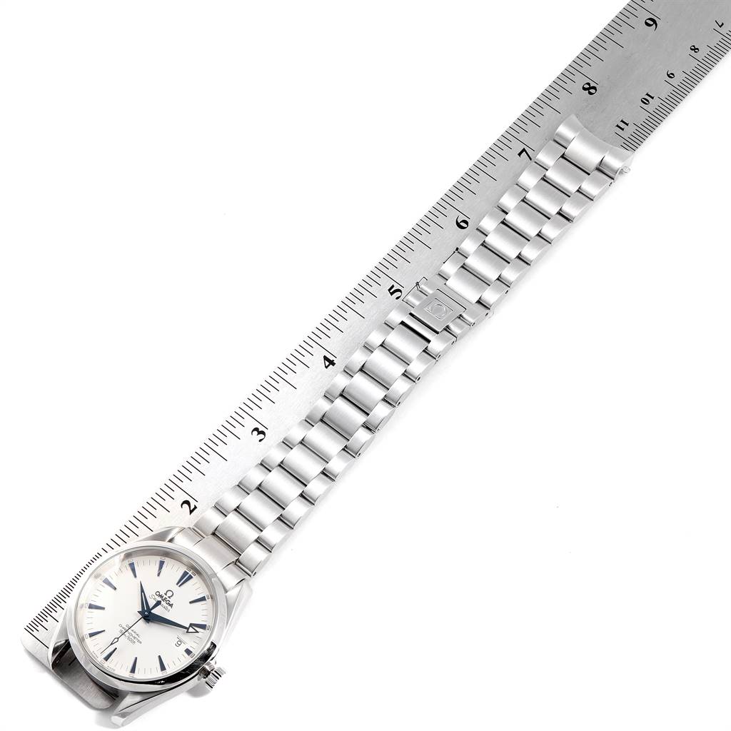 The image shows an Omega Seamaster 2503.33.00 Men
s Stainless Steel Silver Dial 2503.33.00 Men
s Stainless Steel Silver Dial watch laying flat with its metal bracelet extended along a ruler for measurement.