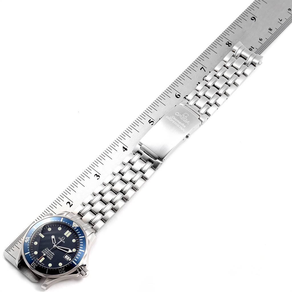 The image shows the Omega Seamaster 2531.80.00 Men
s Stainless Steel Blue Dial 2531.80.00 Men
s Stainless Steel Blue Dial watch lying flat, with the face, bracelet, and clasp visible, alongside a ruler for scale.