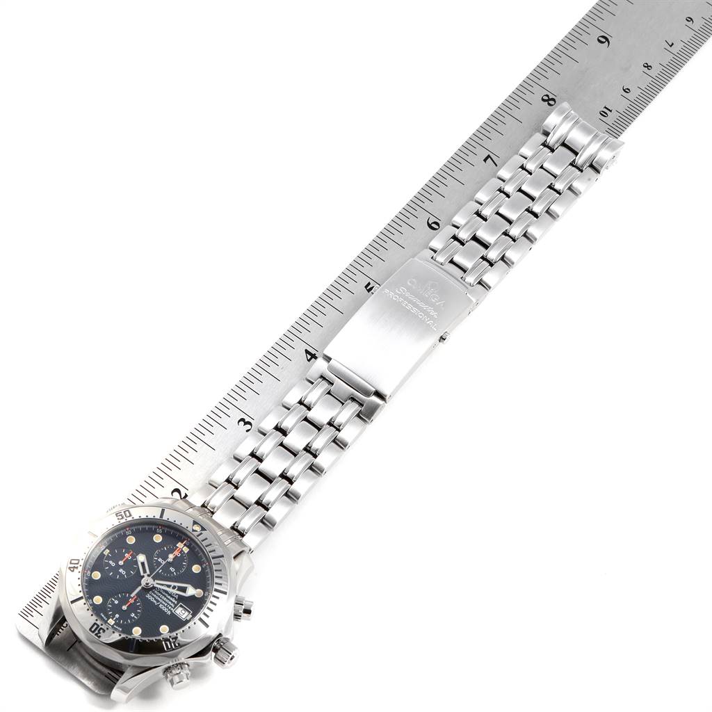 The image shows an Omega Seamaster 2598.80.00 Men
s Stainless Steel Blue Dial 2598.80.00 Men
s Stainless Steel Blue Dial watch laid flat with a focus on the bracelet and clasp, and a ruler beside it for scale.