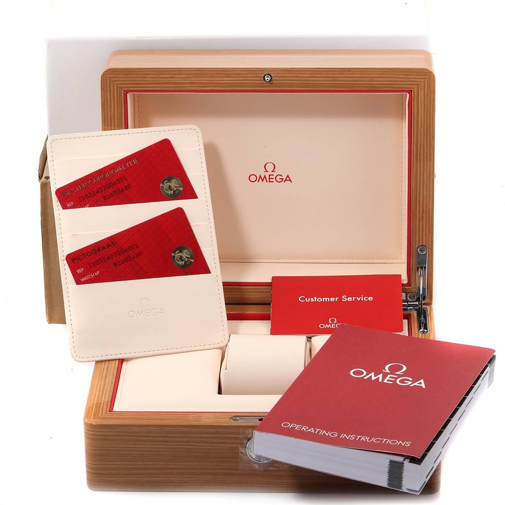 The image shows the packaging and accessories for an Omega Seamaster 210.32.42.20.06.001 Men's Stainless Steel Grey Dial 210.32.42.20.06.001 Men's Stainless Steel Grey Dial, including the box, warranty cards, and manuals.