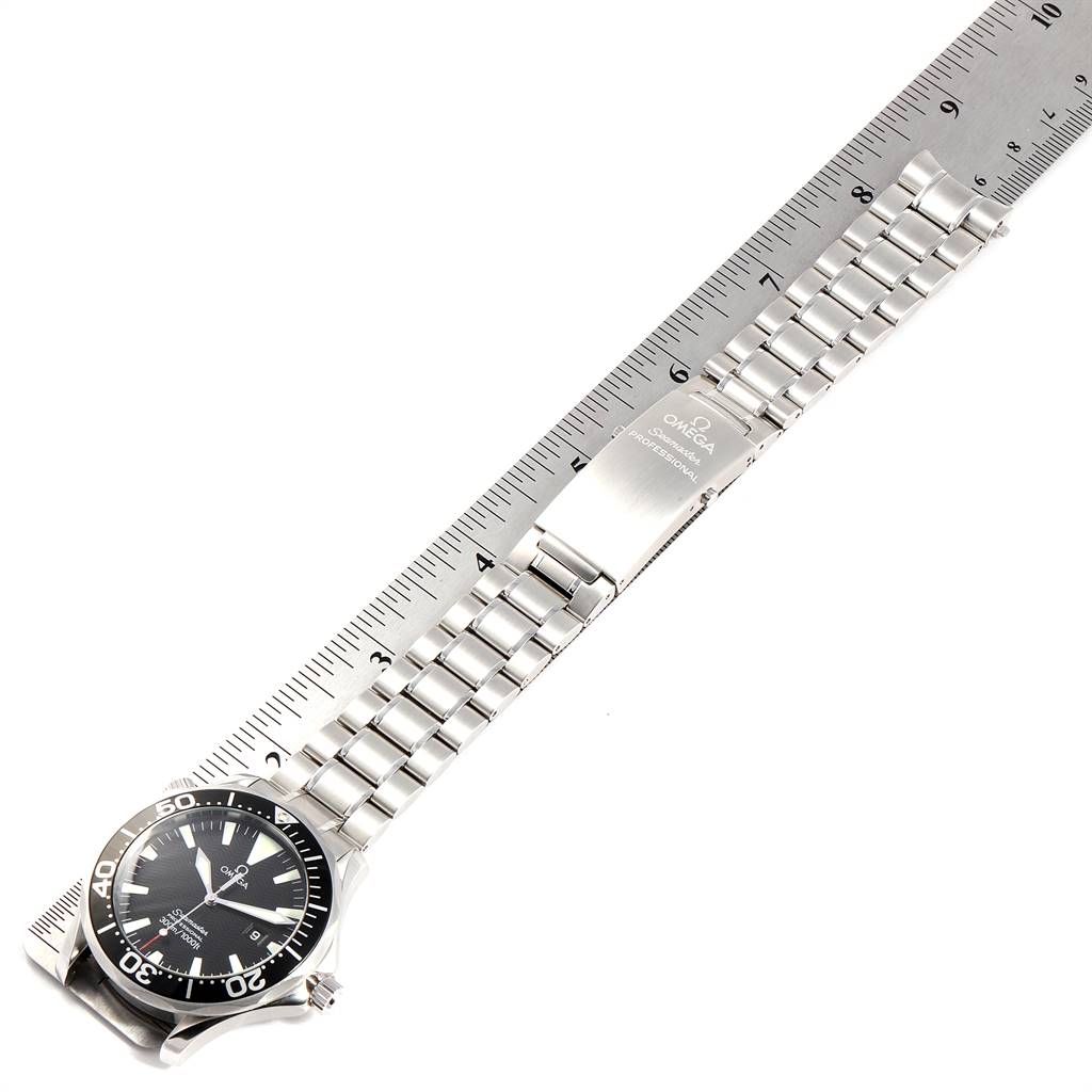 The image shows an Omega Seamaster 2264.50.00 Men
s Stainless Steel Black Dial 2264.50.00 Men
s Stainless Steel Black Dial watch laid flat, highlighting the face, bracelet, and clasp alongside a ruler for size reference.