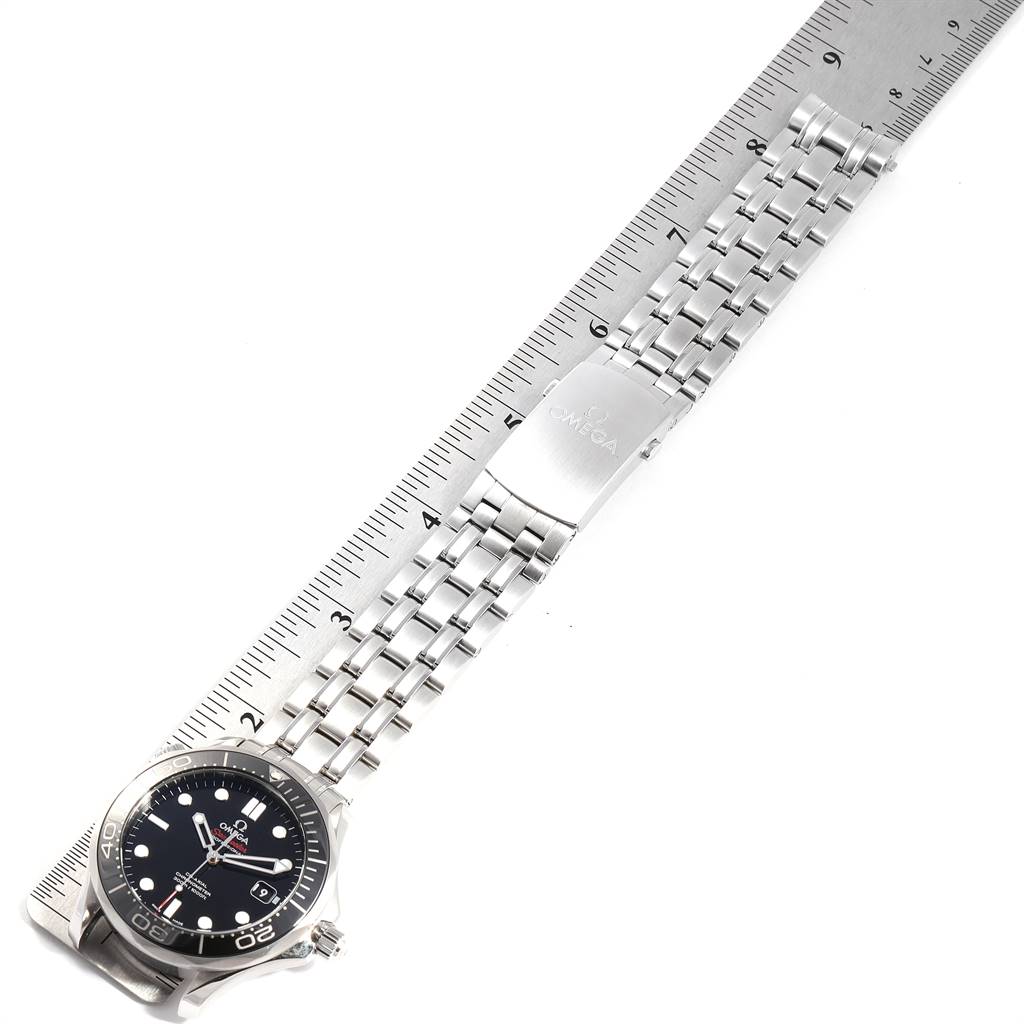 The Omega Seamaster 212.30.41.20.01.003 Men
s Stainless Steel Black Dial 212.30.41.20.01.003 Men
s Stainless Steel Black Dial watch is shown from an overhead angle, displaying the face and full metal bracelet alongside a ruler.