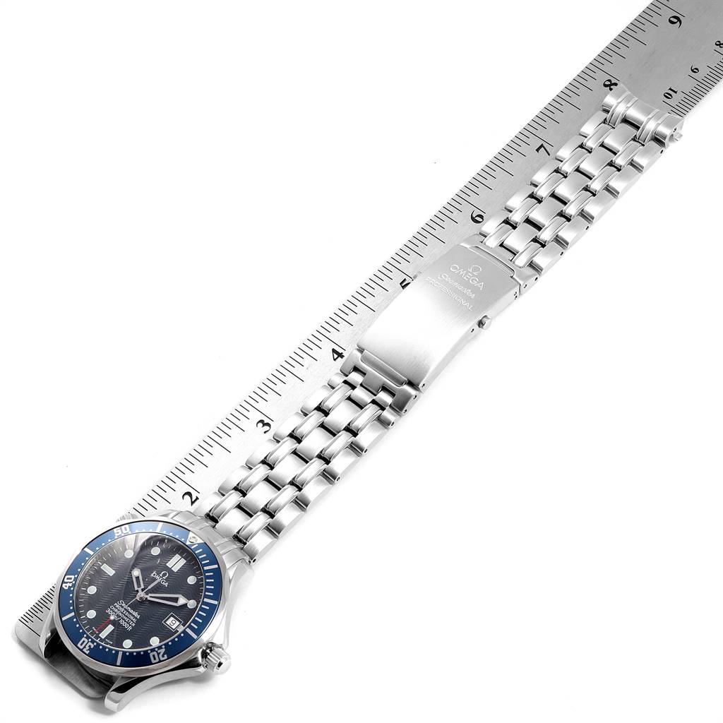 The image shows the Omega Seamaster 2531.80.00 Men
s Stainless Steel Blue Dial 2531.80.00 Men
s Stainless Steel Blue Dial watch laid flat with its bracelet and clasp, positioned next to a ruler for measuring.
