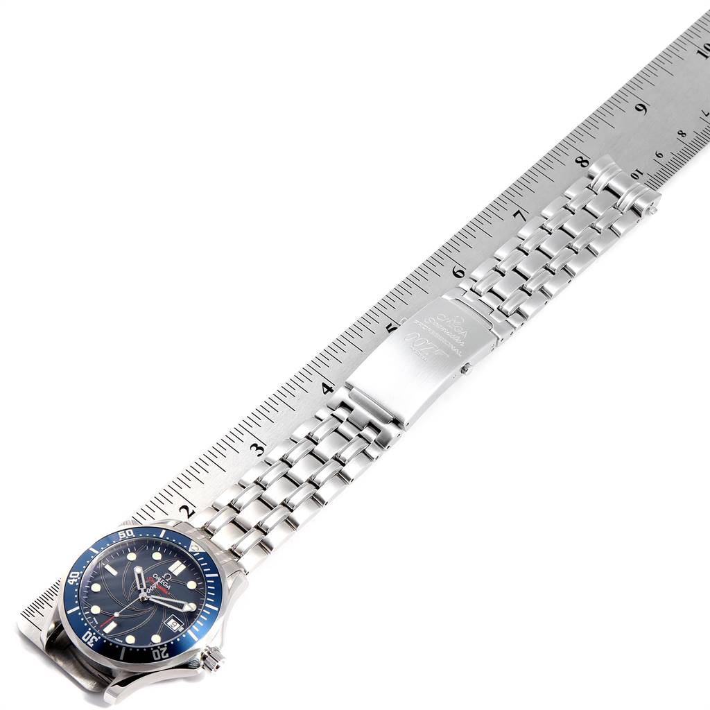 The Omega Seamaster 2226.80.00 Men's Stainless Steel Blue Dial 2226.80.00 Men's Stainless Steel Blue Dial watch is shown with its band fully extended and laid against a ruler for measurement.