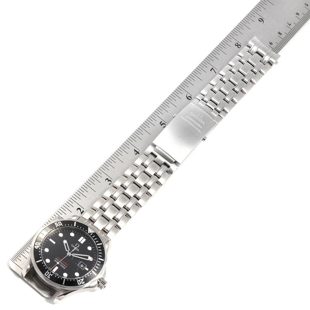 The Omega Seamaster 212.30.41.61.01.001 Men
s Stainless Steel Black Dial 212.30.41.61.01.001 Men
s Stainless Steel Black Dial watch is shown at an oblique angle, displaying the face, bezel, and metal bracelet next to a ruler.