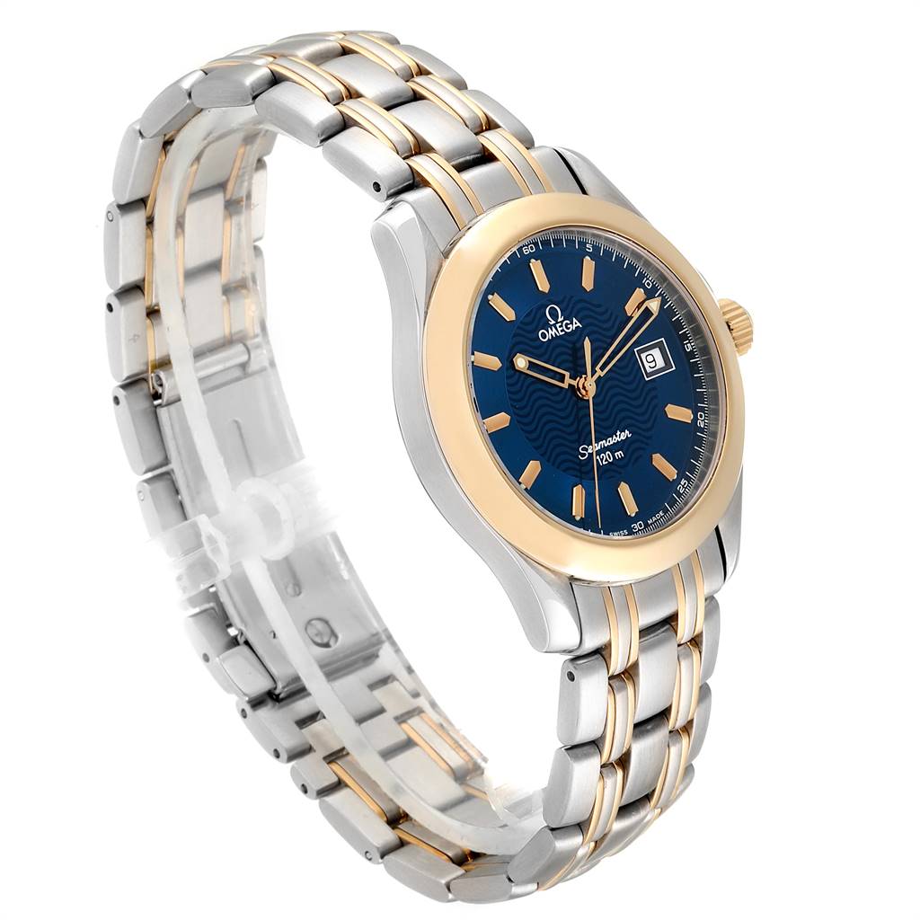 The Omega Seamaster 2311.81.00 Men's Steel and Gold (two tone) Blue Dial 2311.81.00 Men's Steel and Gold (two tone) Blue Dial watch is shown at an oblique angle, highlighting its silver and gold bracelet, blue dial, and date display.