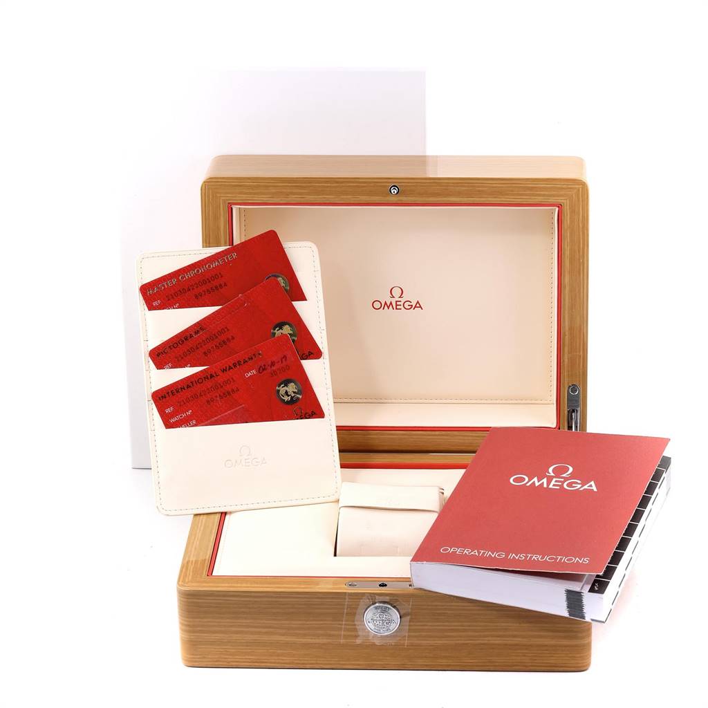 The image shows a wooden Omega Seamaster 210.30.42.20.01.001 Men
s Stainless Steel Black Dial 210.30.42.20.01.001 Men
s Stainless Steel Black Dial watch box, warranty cards, an operating instructions booklet, and a small white pouch.