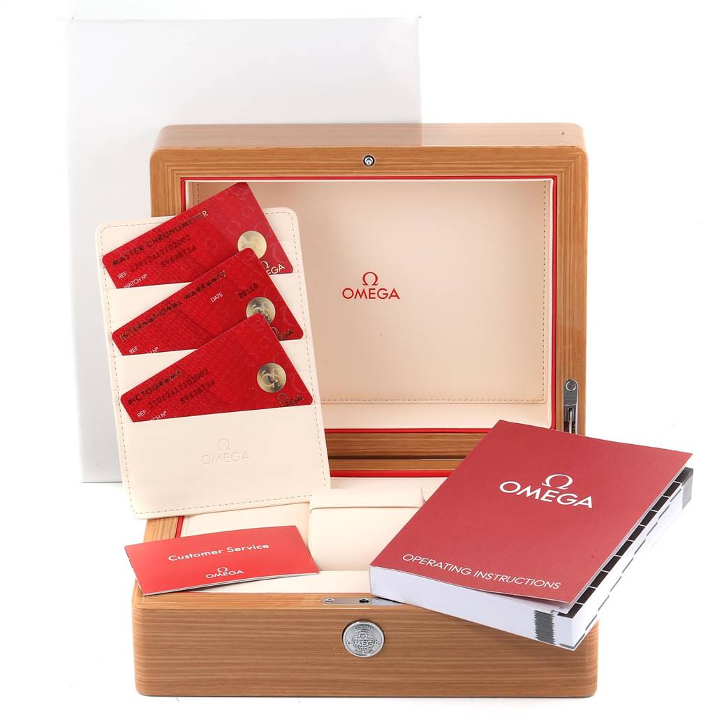 This image shows accessories for the Omega Seamaster 220.12.41.21.02.002 Men
s Stainless Steel Silver Dial 220.12.41.21.02.002 Men
s Stainless Steel Silver Dial, including a wooden box, instruction manuals, and warranty cards.