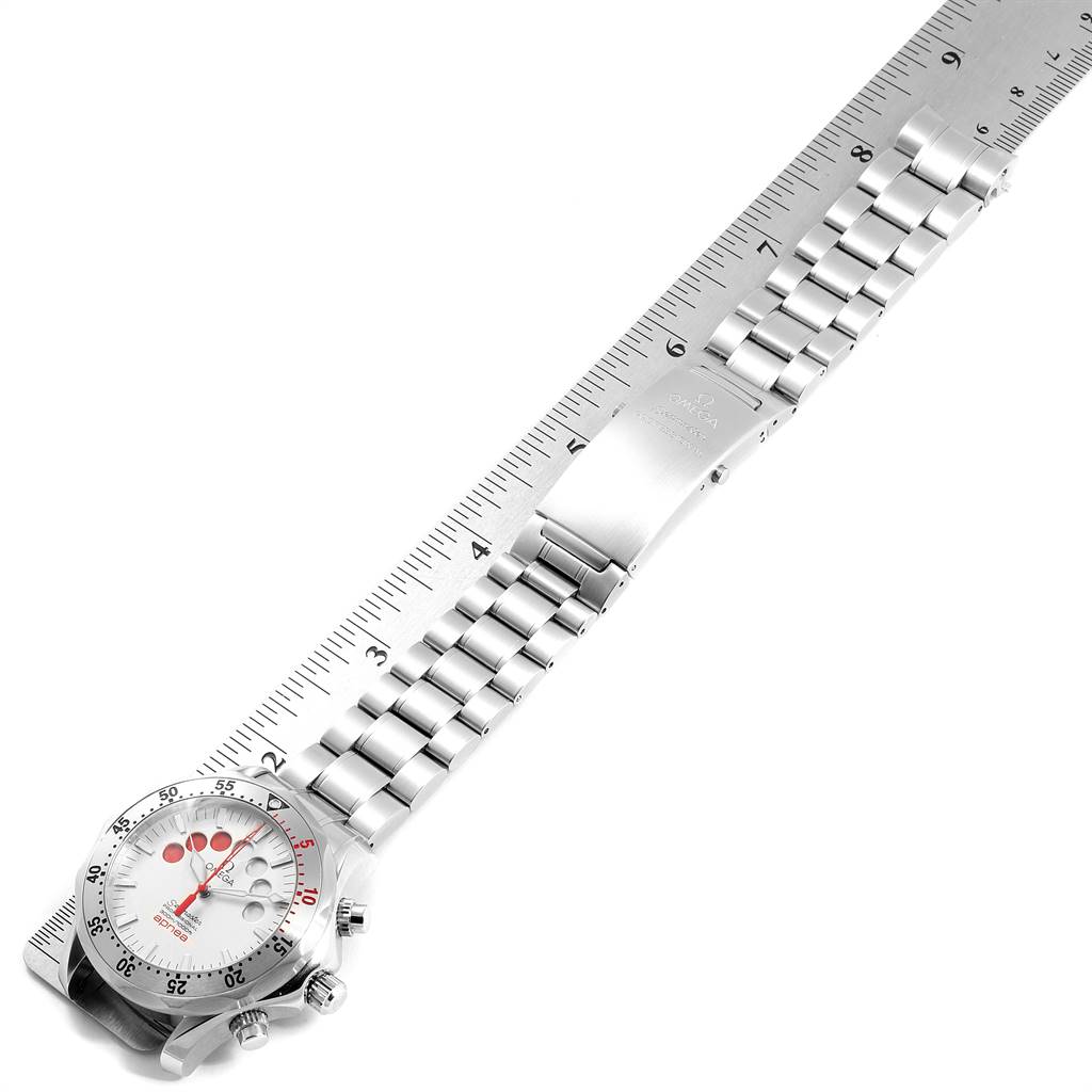 This image shows an Omega Seamaster 2595.30.00 Men
s Stainless Steel Silver Dial 2595.30.00 Men
s Stainless Steel Silver Dial watch placed diagonally, highlighting its face, bezel, and metal bracelet beside a ruler.