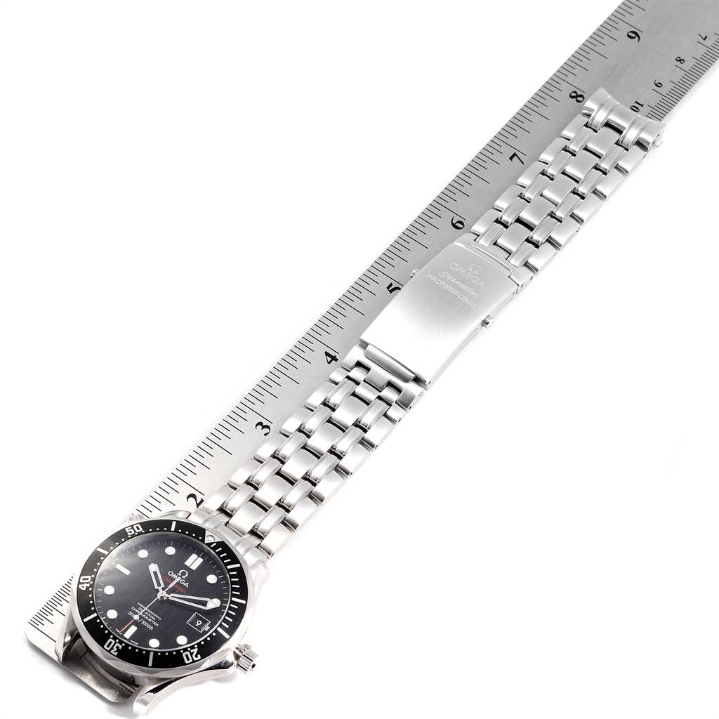 This image shows an Omega Seamaster 212.30.41.20.01.002 Men
s Stainless Steel Black Dial 212.30.41.20.01.002 Men
s Stainless Steel Black Dial watch laying flat with its stainless steel bracelet extended and measured against a ruler.