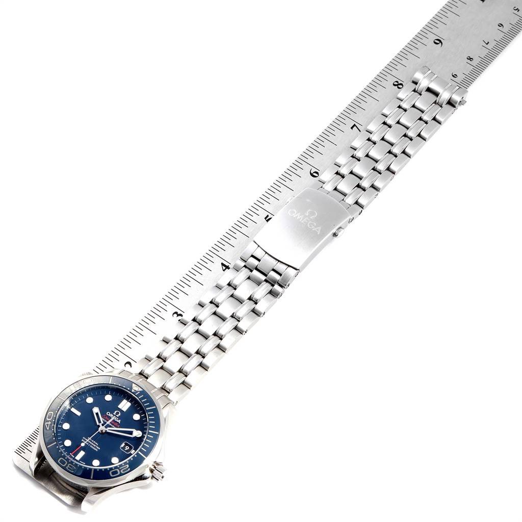 This image shows an Omega Seamaster 212.30.41.20.03.001 Men
s Stainless Steel Blue Dial 212.30.41.20.03.001 Men
s Stainless Steel Blue Dial watch laid flat against a ruler, displaying its stainless steel bracelet and clasp from a top-down angle.