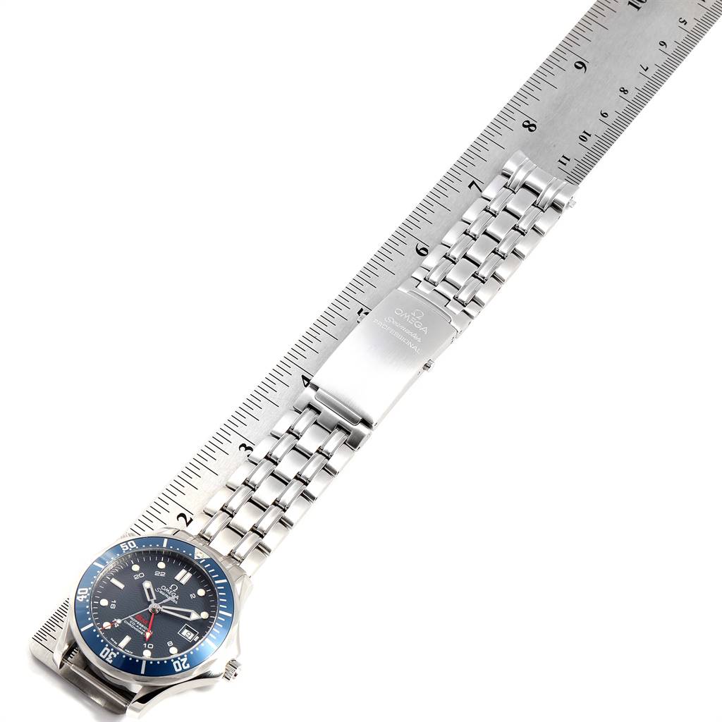 The Omega Seamaster 2535.80.00 Men
s Stainless Steel Blue Dial 2535.80.00 Men
s Stainless Steel Blue Dial watch is shown from an overhead angle, displaying the face, bezel, and stainless steel band with a ruler for scale.