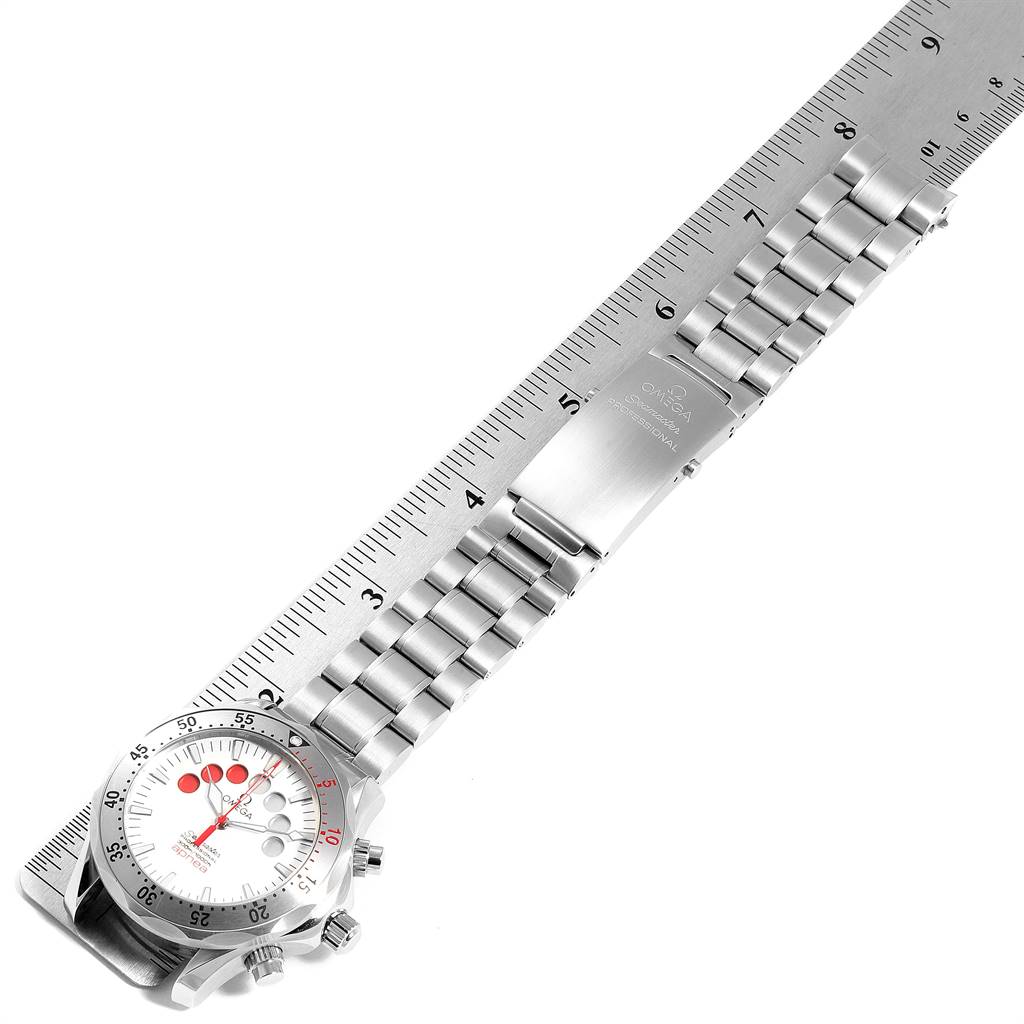 The image shows an Omega Seamaster 2595.30.00 Men's Stainless Steel Silver Dial 2595.30.00 Men's Stainless Steel Silver Dial watch laid flat alongside a ruler, displaying the face, bracelet, and clasp.