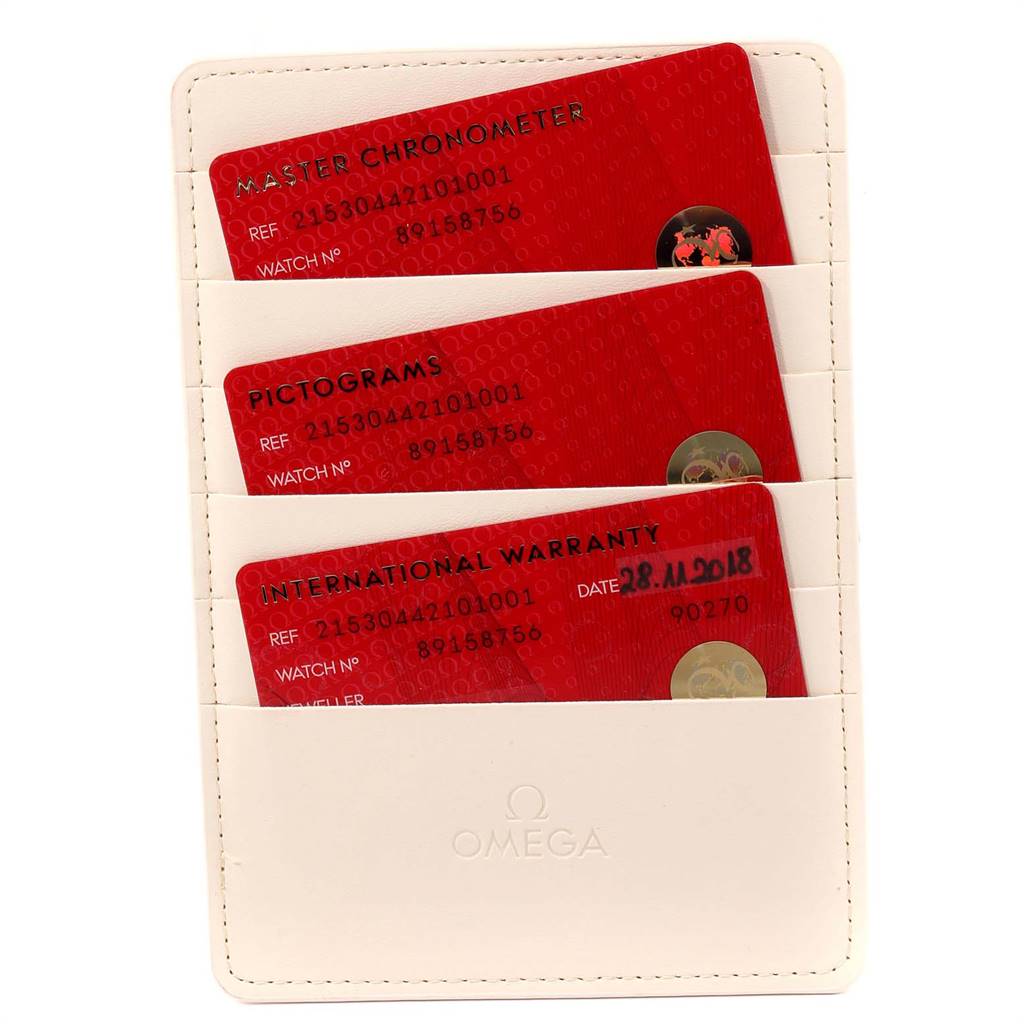 The image shows a set of three red Omega warranty cards for a Planet Ocean model, enclosed in a white branded cardholder.