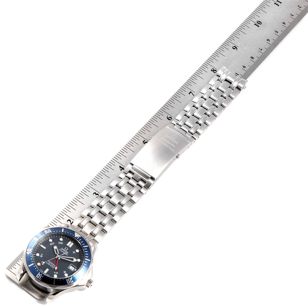 This image shows the face and bracelet of an Omega Seamaster 2535.80.00 Men
s Stainless Steel Blue Dial 2535.80.00 Men
s Stainless Steel Blue Dial watch laid flat next to a ruler.