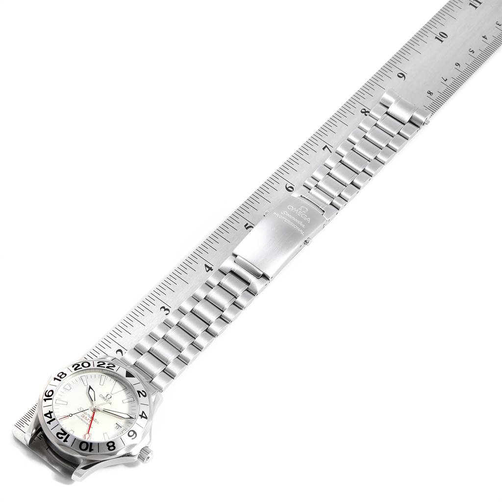 The image shows an Omega Seamaster 2538.20.00 Men
s Stainless Steel White Dial 2538.20.00 Men
s Stainless Steel White Dial watch with a full view of the stainless steel bracelet and partially visible watch case, placed next to a ruler.