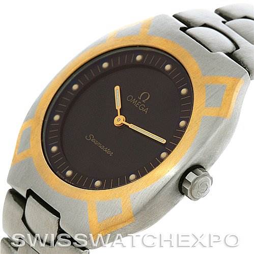 The image shows a side angle of an Omega Seamaster Men's Steel and Gold (two tone) Black Dial Men's Steel and Gold (two tone) Black Dial watch, highlighting the bezel, dial, hands, and part of the bracelet.
