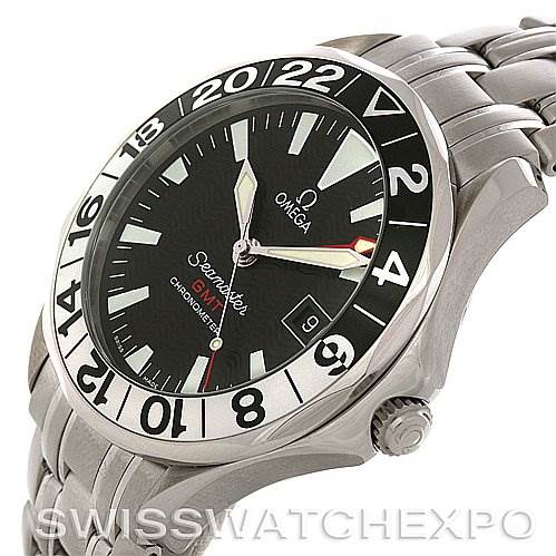 Side angle of the Omega Seamaster 25345000 Men's Stainless Steel Black Dial 25345000 Men's Stainless Steel Black Dial watch showing the bezel, dial, hands, crown, and part of the steel bracelet.