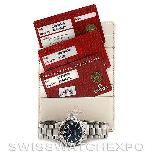 The image shows the Omega Seamaster 22538000 Stainless Steel Blue Dial 22538000 Stainless Steel Blue Dial watch placed in front of its warranty and chronometer certificate cards.