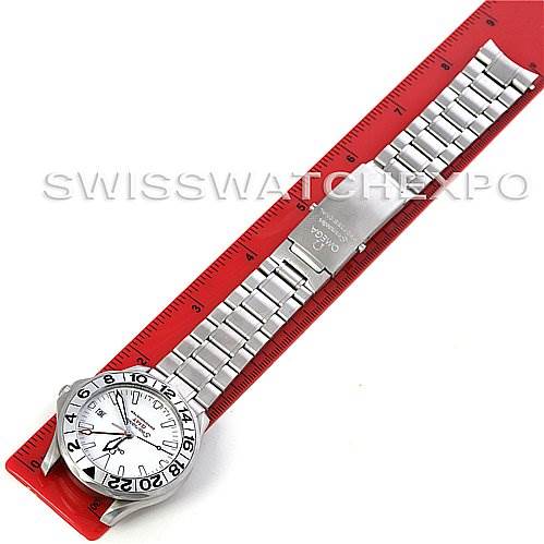 This image shows an Omega Seamaster 25382000 OR 2538.20.00 Men
s Stainless Steel White Dial 25382000 OR 2538.20.00 Men
s Stainless Steel White Dial watch laid flat against a red ruler, displaying its entire bracelet and face from an overhead angle.