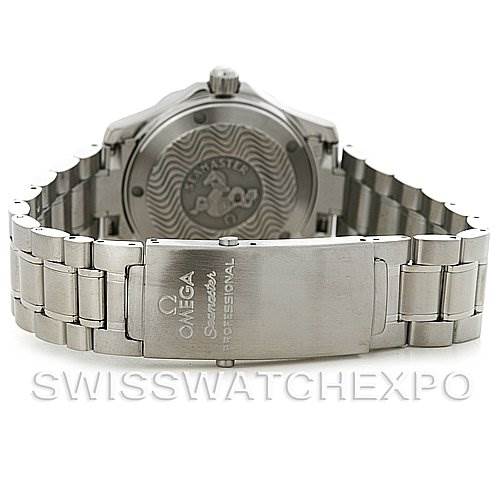 This image shows the backside and wristband of an Omega Seamaster 2263.80.00 Men's Stainless Steel Blue Dial 2263.80.00 Men's Stainless Steel Blue Dial watch, featuring the clasp and case back with wave pattern engraving.