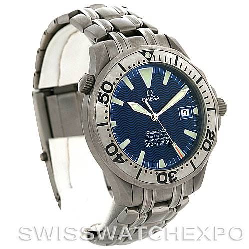 The image shows an angled view of an Omega Seamaster 2231.80.00 Men
s Stainless Steel Blue Dial 2231.80.00 Men
s Stainless Steel Blue Dial watch, highlighting its face, bezel, and metal bracelet.
