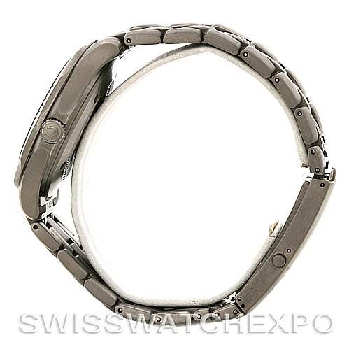 The image shows a side view of the Omega Seamaster 2231.80.00 Men
s Stainless Steel Blue Dial 2231.80.00 Men
s Stainless Steel Blue Dial watch, highlighting its case, crown, and metal bracelet.