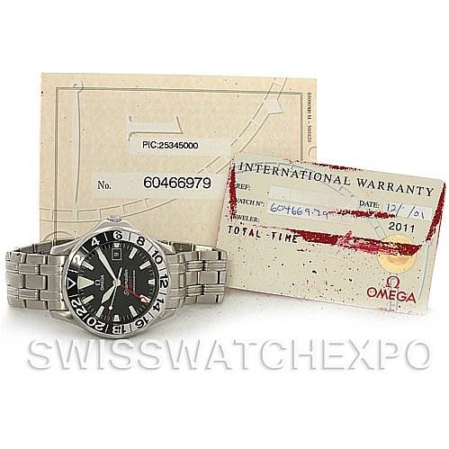 The image shows an Omega Seamaster 2534.50 Men
s Stainless Steel Black Dial 2534.50 Men
s Stainless Steel Black Dial watch with a stainless steel bracelet, warranty card, and associated documentation.