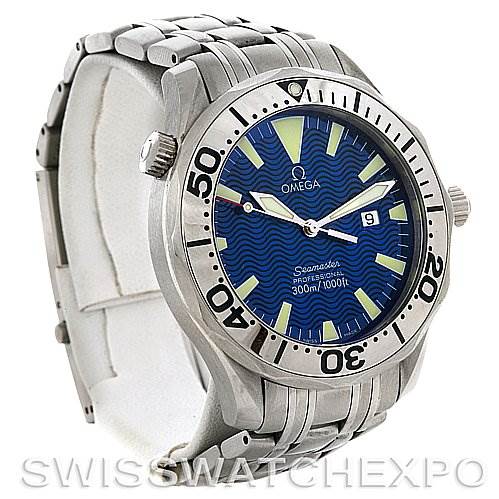 The image shows an Omega Seamaster 2065.80 Men
s Stainless Steel Blue Dial 2065.80 Men
s Stainless Steel Blue Dial watch at an angled side view, highlighting its blue dial, bezel markings, and stainless steel bracelet.