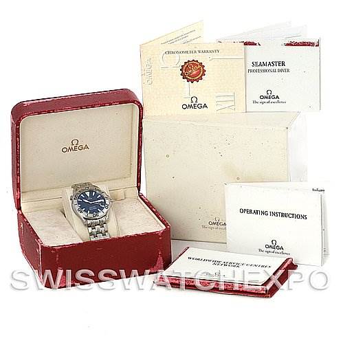 The image shows an Omega Seamaster 2065.80 Men
s Stainless Steel Blue Dial 2065.80 Men
s Stainless Steel Blue Dial watch in its box, along with warranty cards and operating instructions.