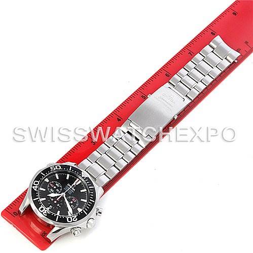 The Omega Seamaster 2594.52 Men's Stainless Steel Black Dial 2594.52 Men's Stainless Steel Black Dial watch is shown from a top-down angle, displaying its face and stainless steel bracelet laid against a ruler.