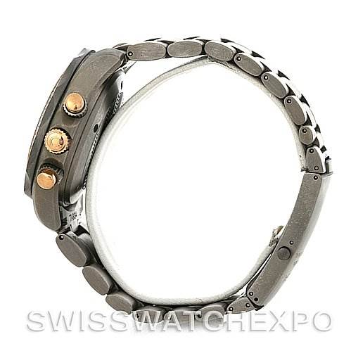 Side view of an Omega Seamaster 2294.50.00 Men's Titanium Black Dial 2294.50.00 Men's Titanium Black Dial watch showing the bracelet and three control crowns.