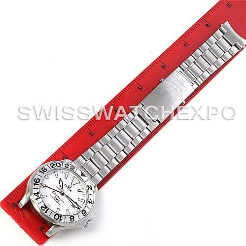 This image shows an Omega Seamaster 2538.20.00 Men
s Stainless Steel White Dial 2538.20.00 Men
s Stainless Steel White Dial watch from a top-down angle, alongside a red ruler measuring its metal bracelet.