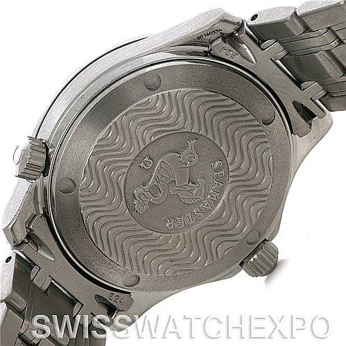 The image shows the back case of an Omega Seamaster 212.30.36.20.01.001 Women's Stainless Steel Black Dial 212.30.36.20.01.001 Women's Stainless Steel Black Dial watch, highlighting the engraved wave pattern and the metal bracelet link.