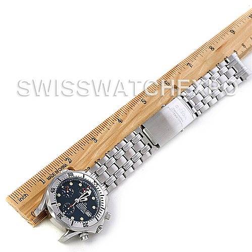 The Omega Seamaster 2598.80.00 Men
s Stainless Steel Blue Dial 2598.80.00 Men
s Stainless Steel Blue Dial watch is shown face-up, with its stainless steel bracelet extended beside a ruler for measurement.