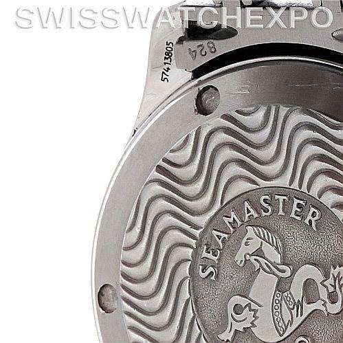 The image shows a close-up of the case back of an Omega Seamaster 2223.80.00 Men's Stainless Steel Blue Dial 2223.80.00 Men's Stainless Steel Blue Dial watch, featuring its emblem and wavy pattern detailing.