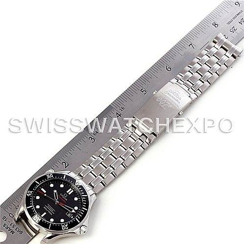 The Omega Seamaster 212.30.41.20.01.001 Men's Stainless Steel Black Dial 212.30.41.20.01.001 Men's Stainless Steel Black Dial watch is shown from an overhead angle, displaying its face and metal bracelet alongside a ruler for scale.