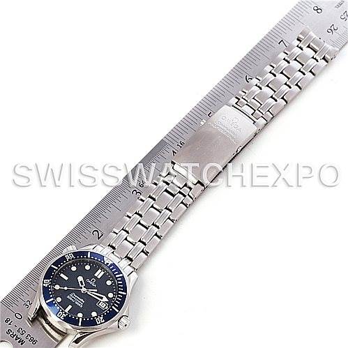 The image shows an Omega Seamaster 2223.80.00 Men's Stainless Steel Blue Dial 2223.80.00 Men's Stainless Steel Blue Dial watch laid flat, displaying the face, bezel, and full metal bracelet next to a ruler.