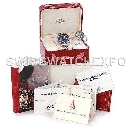 The image shows an Omega Seamaster 2599.80 Men's Stainless Steel Blue Dial 2599.80 Men's Stainless Steel Blue Dial watch at a tilted angle, with its box, manuals, and certification documents.