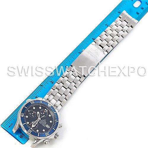 This image shows an Omega Seamaster 2599.80 Men's Stainless Steel Blue Dial 2599.80 Men's Stainless Steel Blue Dial watch displayed next to a blue ruler, featuring the face and metal bracelet.