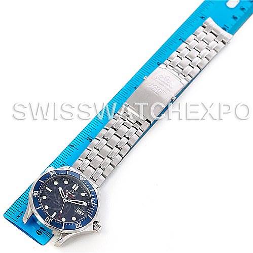 The Omega Seamaster 2226.80 Men's Stainless Steel Blue Dial 2226.80 Men's Stainless Steel Blue Dial watch is displayed showing the full band and face, lying next to a blue ruler for scale.