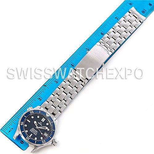 The image shows an Omega Seamaster 2562.80.00 Men's Stainless Steel Blue Dial 2562.80.00 Men's Stainless Steel Blue Dial watch laid flat beside a ruler, displaying its face and metal bracelet.