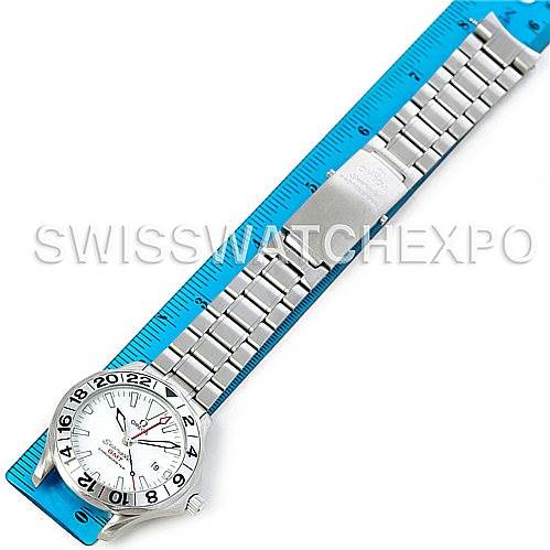 The Omega Seamaster 2538.20.00 Men
s Stainless Steel White Dial 2538.20.00 Men
s Stainless Steel White Dial watch is shown from a top-down angle, displaying the dial, bezel, and metal bracelet against a blue ruler.