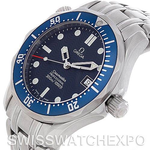 The image shows a close-up of the Omega Seamaster 2223.80.00 Men's Stainless Steel Blue Dial 2223.80.00 Men's Stainless Steel Blue Dial watch, highlighting the blue bezel, dial, crown, and part of the stainless steel bracelet.