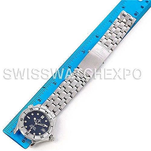 The image shows an overhead view of an Omega Seamaster 2562.80.00 Men
s Stainless Steel Blue Dial 2562.80.00 Men
s Stainless Steel Blue Dial watch laid next to a ruler, displaying the entire watch and its bracelet.