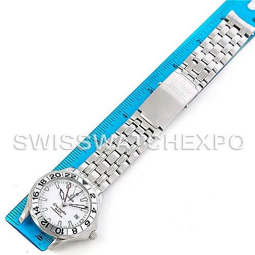 The Omega Seamaster 2538.20.00 Men
s Stainless Steel White Dial 2538.20.00 Men
s Stainless Steel White Dial watch is shown laid flat with the full face and metal bracelet visible against a measuring ruler.